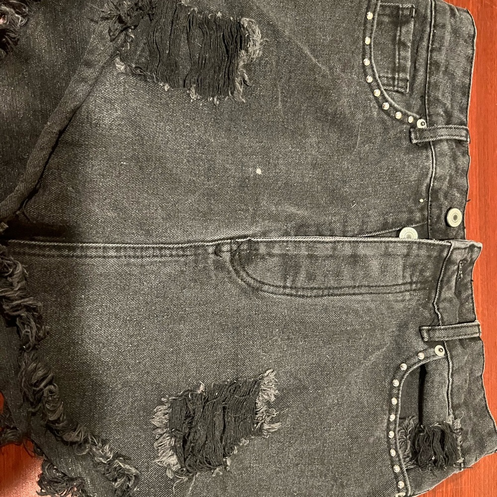 Black denim skirt with studs